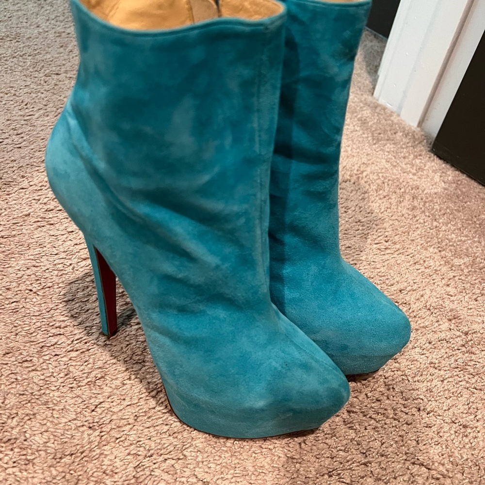 Gently used blue genuine suede high heel platform boots. Size 6